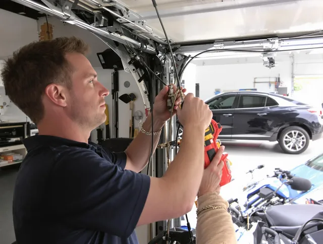 East Hartford Garage Door Repair safety certified technician performing cable replacement in East Hartford