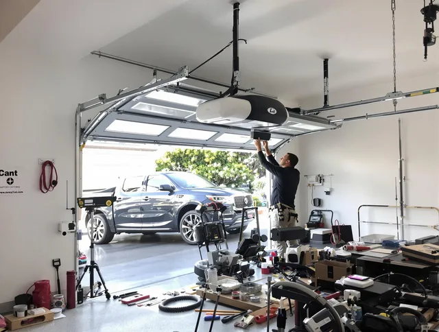 East Hartford Garage Door Repair specialist installing smart garage door opener system in East Hartford home