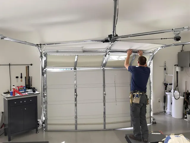 East Hartford Garage Door Repair specialist performing precise section replacement on East Hartford garage door