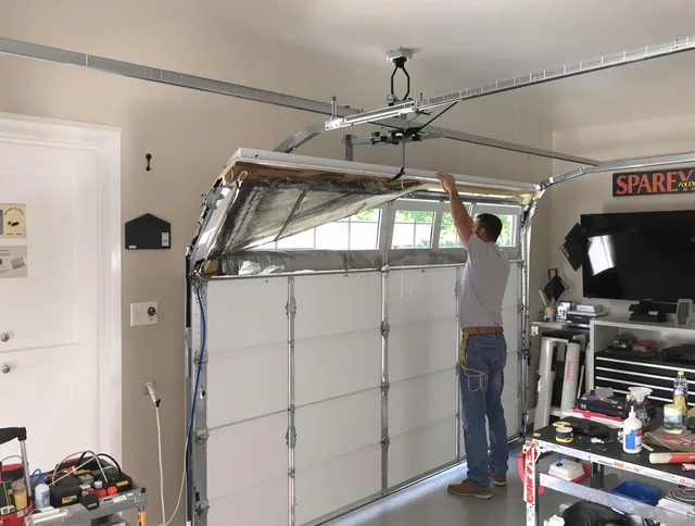 Garage door section replacement by East Hartford Garage Door Repair in East Hartford